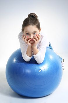 Portrait of little girl with a rubber ball