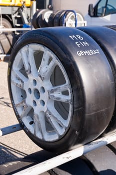 Slick tyre on rack, marked