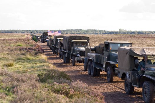 EDE, THE NETHERLANDS - SEPTEMBER 18: Column of World War 2 amr vehicles at Jan Hilgers Memorial / Airborne drop Arnhem 1944 Memorial in Ede, The Netherlands on September 18, 2010