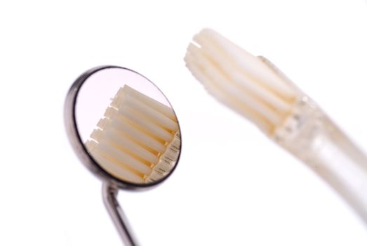 Dentist mirror and tooth brush