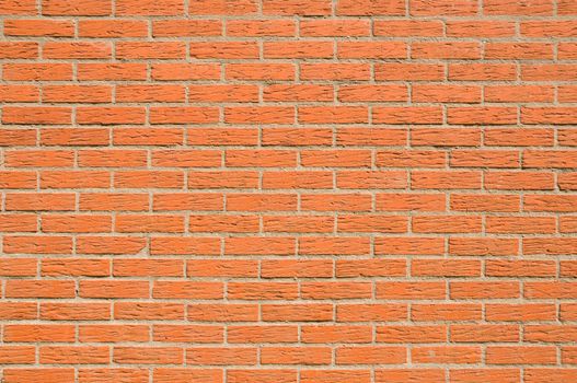 Red brick wall with textured bricks