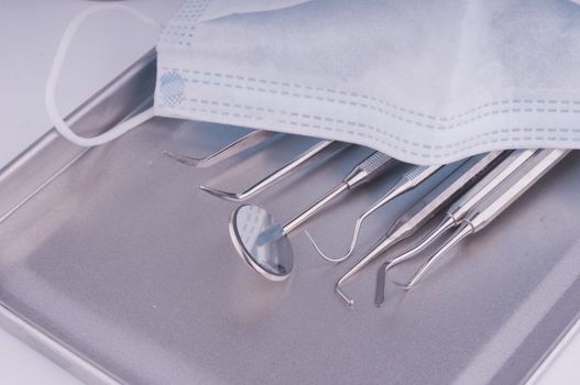 Dentist tools on metal tray