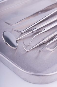 Dentist tools on metal tray