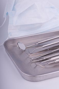 Dentist tools on metal tray