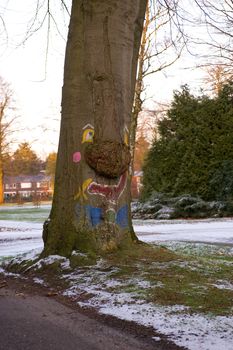 Smile painted on a tree