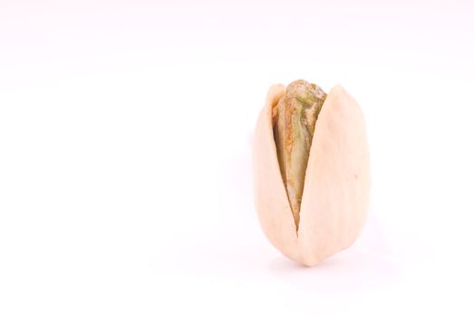 Macro of a pistachio on white 
