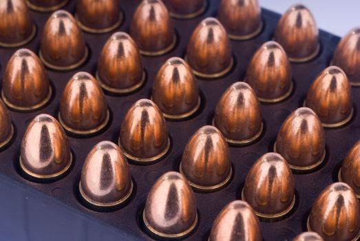 Tray with 9 mm pistol cartridges