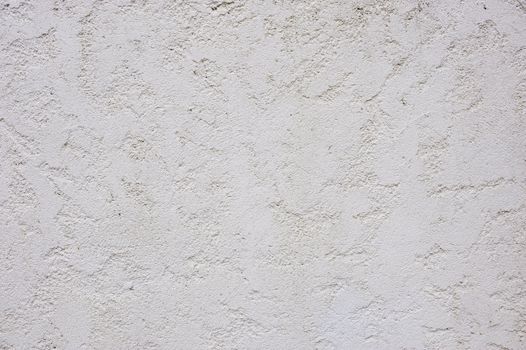 White painted rough textured concrete exterior wall