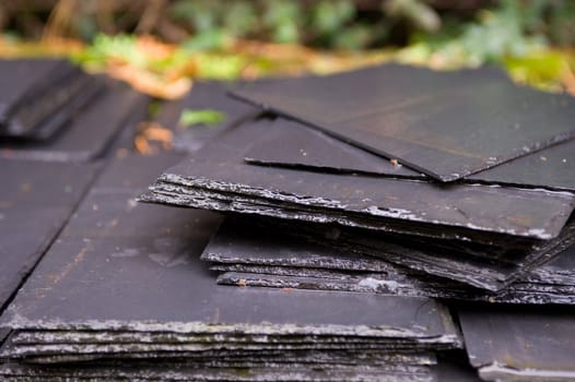 View of a stack of wet slate tiles