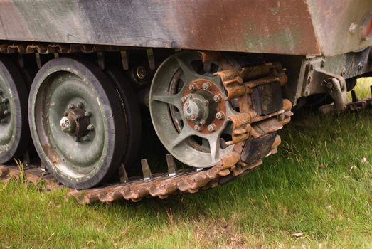 Old and rusty tank tracks on a personel carrier