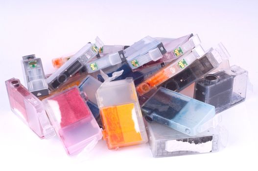 Pile of used olor ink cartridges