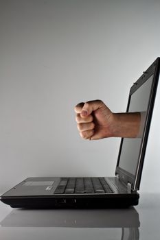 Photo of the laptop with a fist from the screen