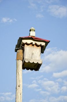 original ornamental wooden nesting box on sky background