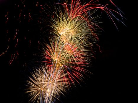 Long Exposure of Multicolored Fireworks Against a Black Sky