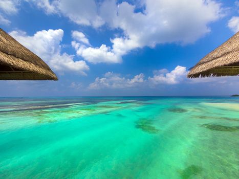 View of the aquamarine water of the Maldives from my bungalow