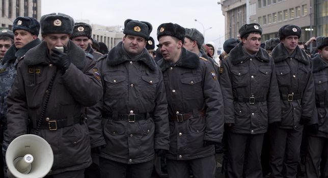 Russia, Moscow - DECEMBER 24: 
Policemen with megaphone at work.
The biggest protest in Russia for the last 20 years. 