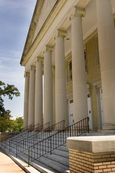 Old stone and brick building with large columns