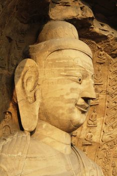 The face of a Big Buddha statue in Yungang caves near Datong (China)