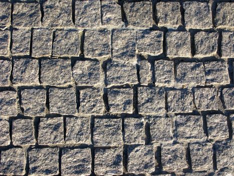Rough grey granite pavement texture