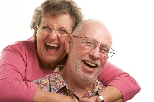 Happy Senior Couple poses for portrait. 