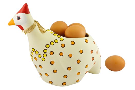Polka-dotted pottery hen with brown eggs inside, isolated on white background