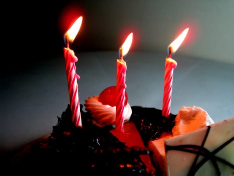 three candles on cakes