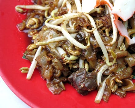 close up for a plate of fry noodles with seafood, asian style food.