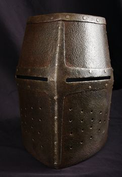 Iron helmet of the medieval knight. Very heavy headdress