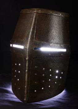 Iron helmet of the medieval knight. Very heavy headdress