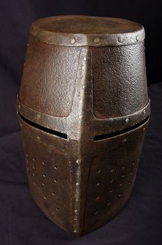 Iron helmet of the medieval knight. Very heavy headdress