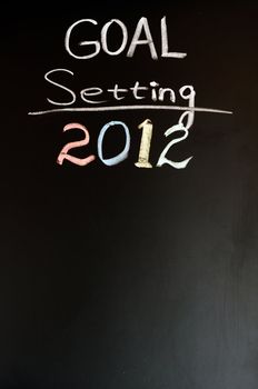 2012 New year goals written with chalk on a blackboard