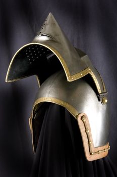 Iron helmet of the medieval knight. Very heavy headdress