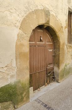 old arched door in Provence, France