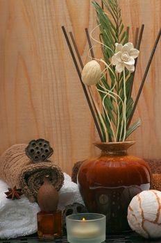 Spa concept with incense diffuser and cotton towels