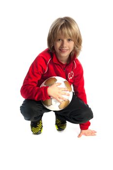 a young boy, with a soccer ball
