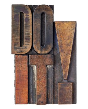 do it exclamation - motivation concept - isolated text in vintage wood letterpress printing blocks stained by color inks