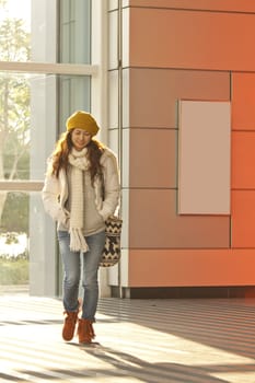 Asian stylish girl in train station walking