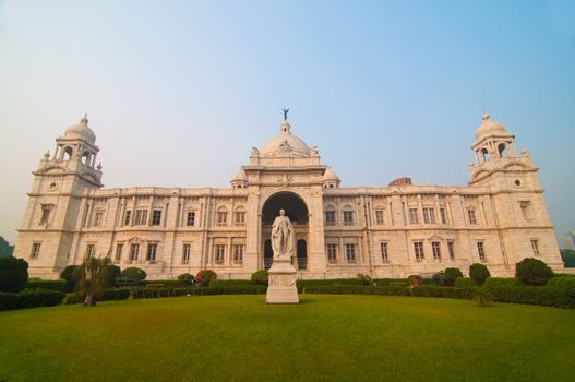 Landmark building of Calcutta or Kolkata, Victoria Memorial Hall with Queen's Garden in the front, white Marble and blue sky