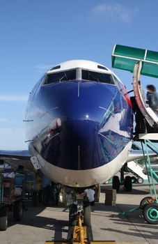 frontal view of passenger airplane in airport