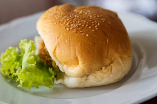 hamburger on white dish.