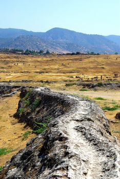 Aqueduct in ancient city Hierapolis. Pamukkale, Turkey.