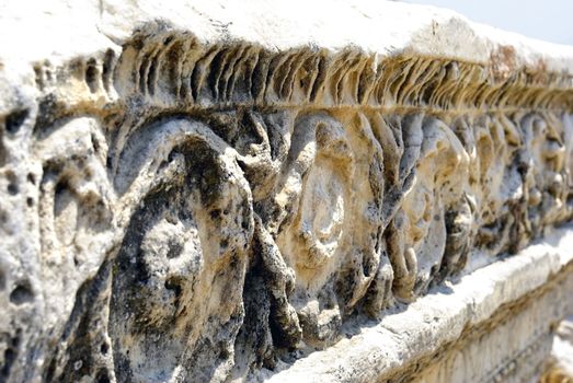 Ancient marble ruins with ornamental decoration. Hierapolis - Pamukkale, Turkey.