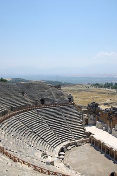 Amphitheater ruins in ancient city Hierapolis. Pamukkale, Turkey. Middle Asia.