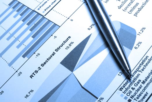 Steel pen laying on printed diagram.