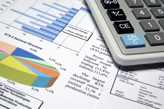 Calculator and printed diagrams.