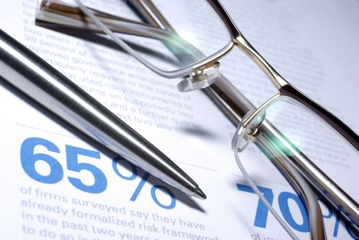 Glasses and pen macro closeup. Business Concept.