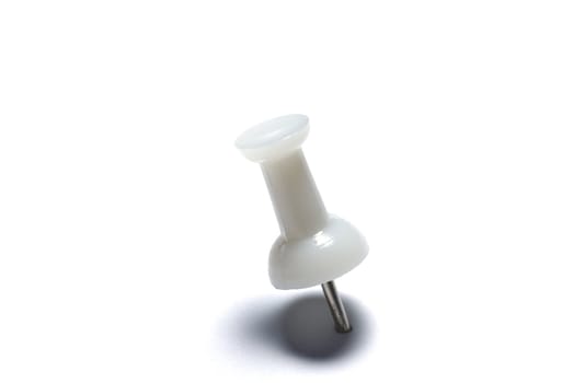 Closeup of white drawing pin isolated on white background.