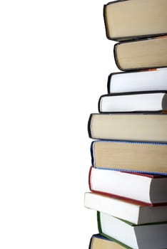 Vertical stack of different books isolated on white background. Clipping path.