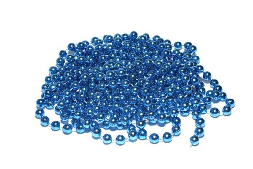 Blue christmas beads isolated on white background.