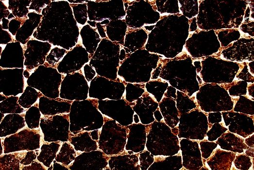 Burnt volcanic stone abstract textured background.